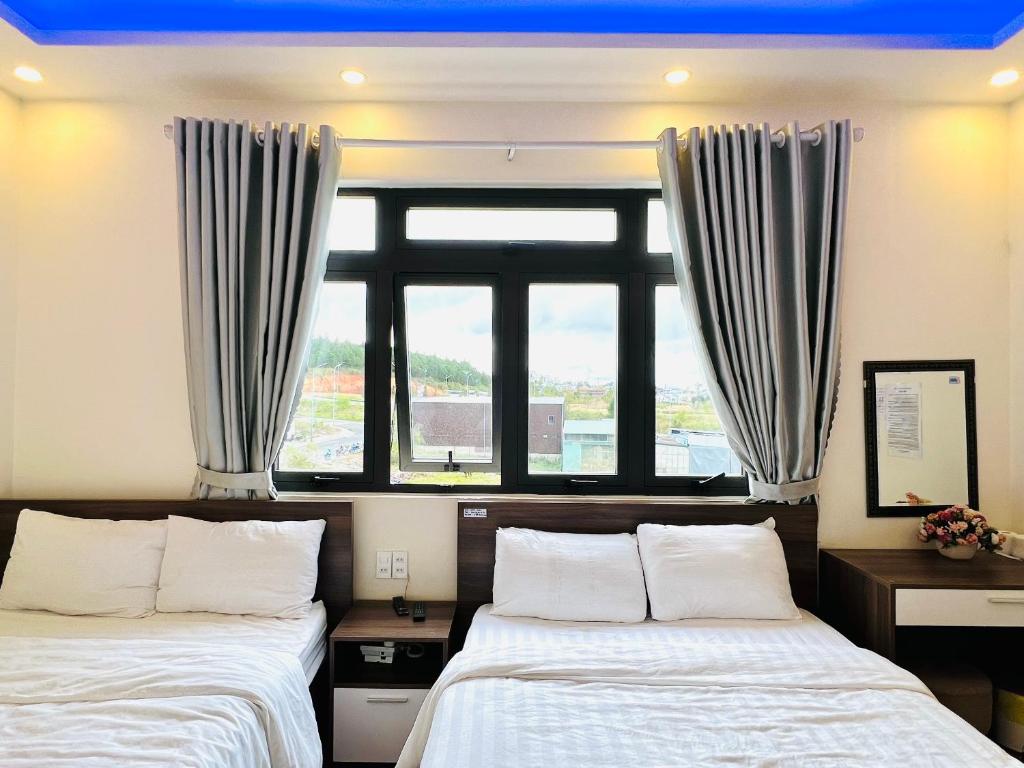 Postel nebo postele na pokoji v ubytování Hotel Duy Dũng - Đà Lạt