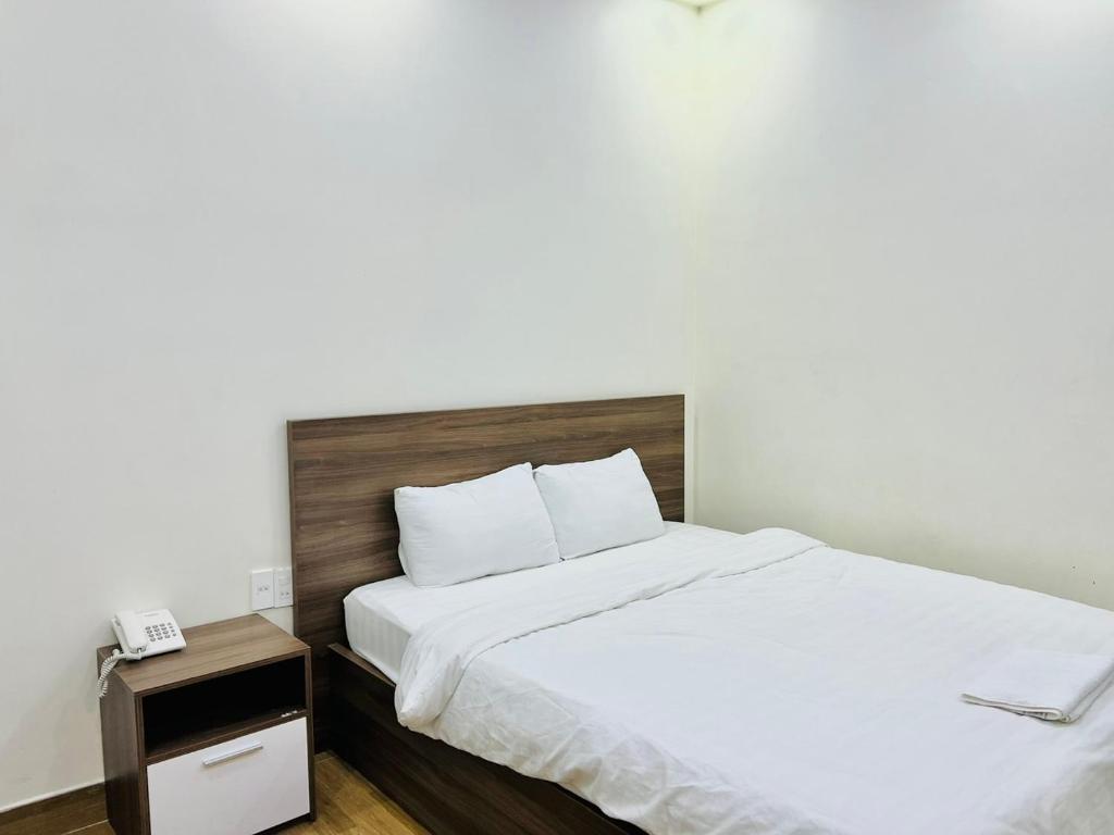 Postel nebo postele na pokoji v ubytování Hotel Duy Dũng - Đà Lạt