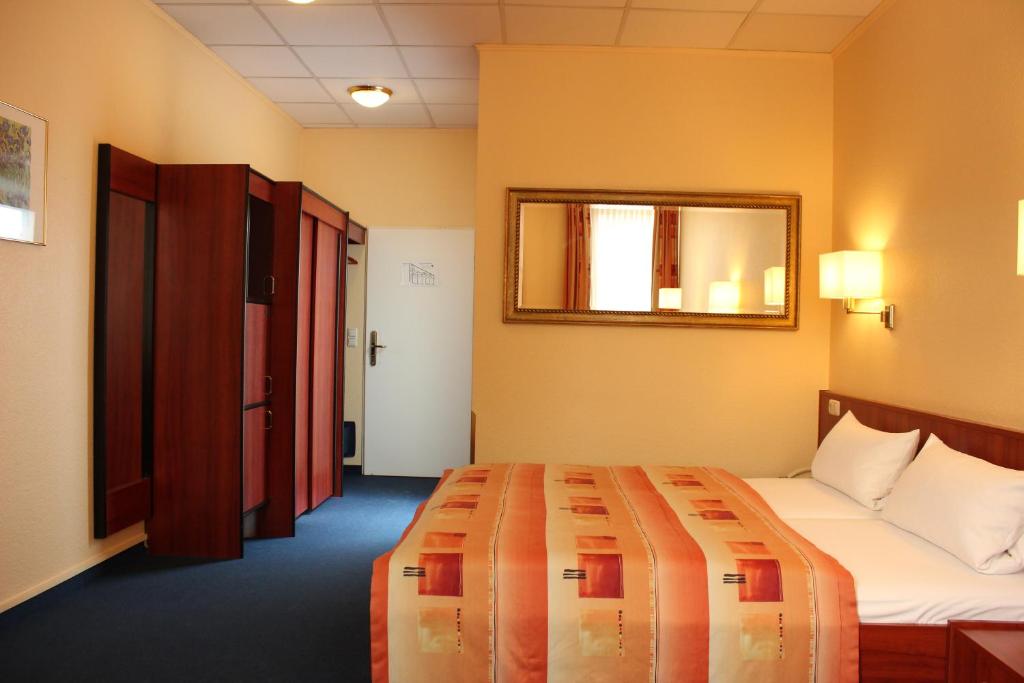 Postel nebo postele na pokoji v ubytování Cabo Nonsmoking-Hotel 