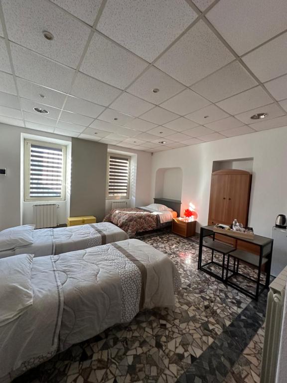 Postel nebo postele na pokoji v ubytování B&B Orchidea Bianca