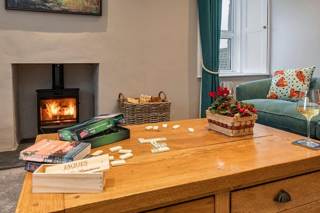 a living room with a coffee table and a fireplace at Home in Kelso Scottish Borders in Kelso