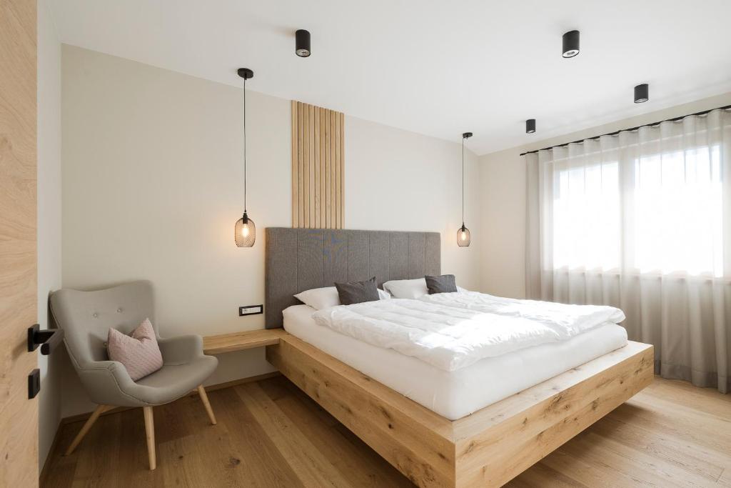 Postel nebo postele na pokoji v ubytování Boutique Hotel Wiesenhof - Adults Only