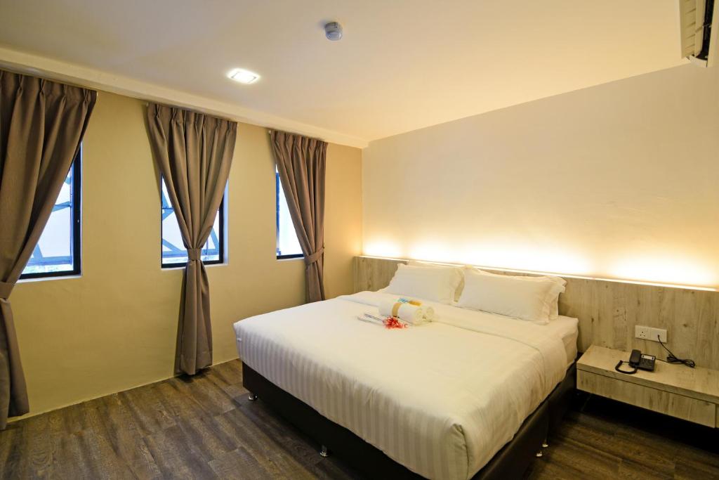 Postel nebo postele na pokoji v ubytování De Parkview Hotel