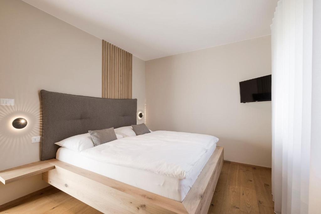 Postel nebo postele na pokoji v ubytování Boutique Hotel Wiesenhof - Adults Only