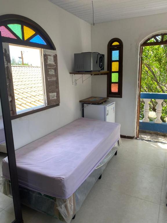 Postel nebo postele na pokoji v ubytování Recanto dos Machados