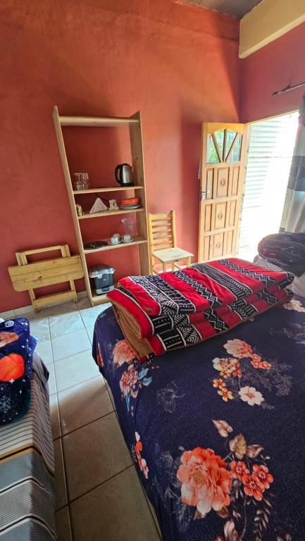 Postel nebo postele na pokoji v ubytování Hotel Los Chow Chow