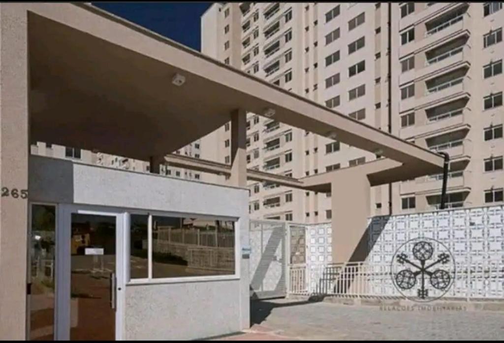 awning over a building with buildings in the background at Apartamento 3 Quartos - 807D in Contagem