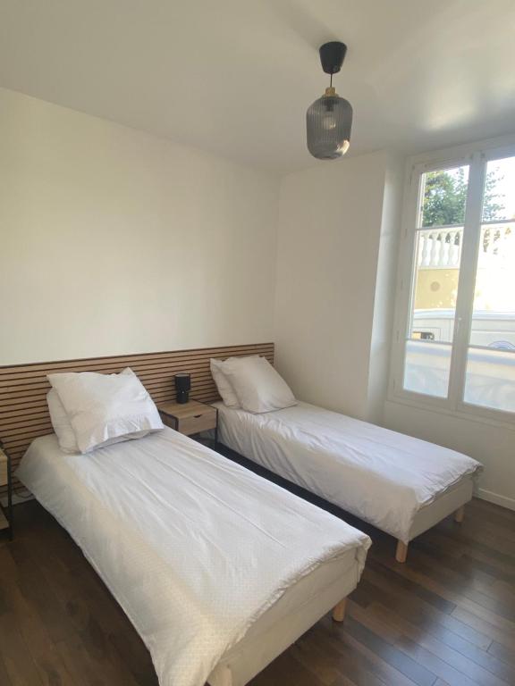 Posteľ alebo postele v izbe v ubytovaní Hôtel Particulier
