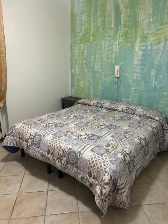 Postel nebo postele na pokoji v ubytování Albergo La Grolla
