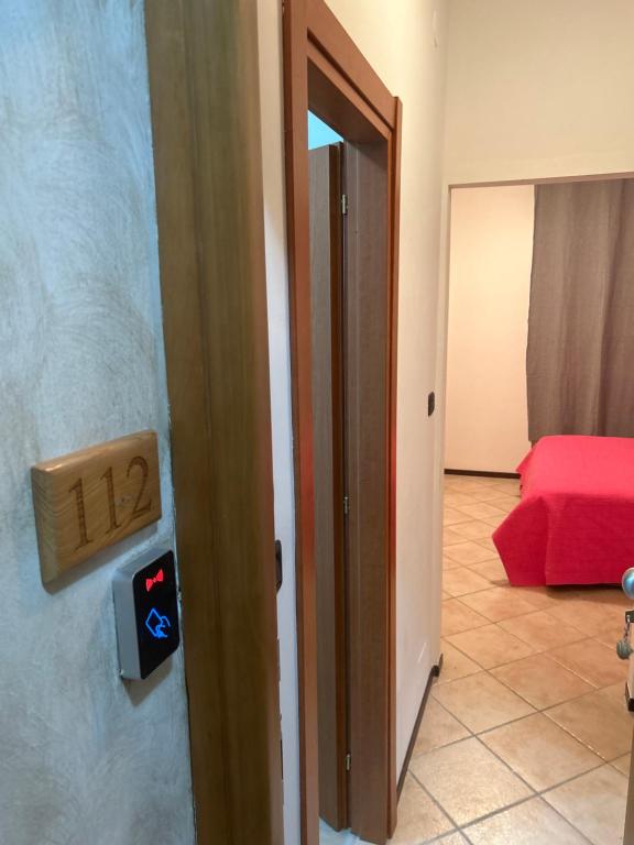 Postel nebo postele na pokoji v ubytování Albergo La Grolla