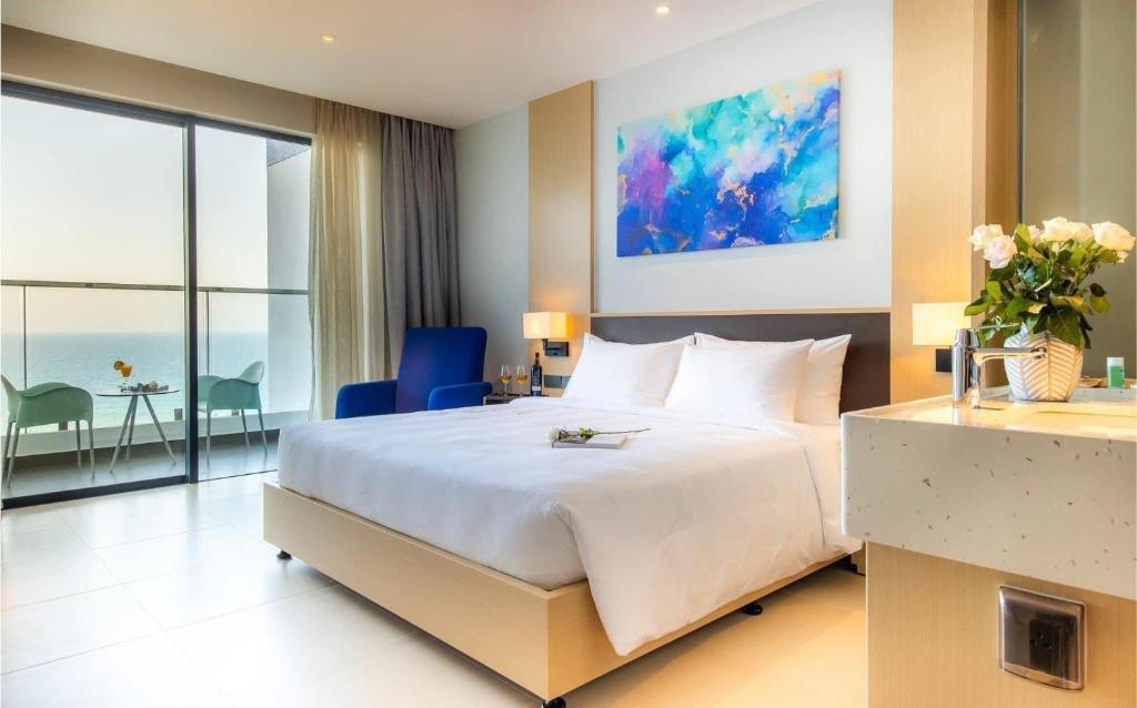 Postel nebo postele na pokoji v ubytování K' căn hộ view biển gần Sân bay Cam Ranh