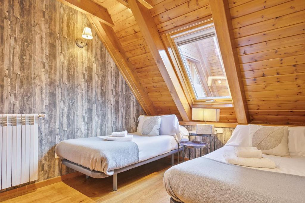 Postel nebo postele na pokoji v ubytování Luderna - Dúplex des Neres