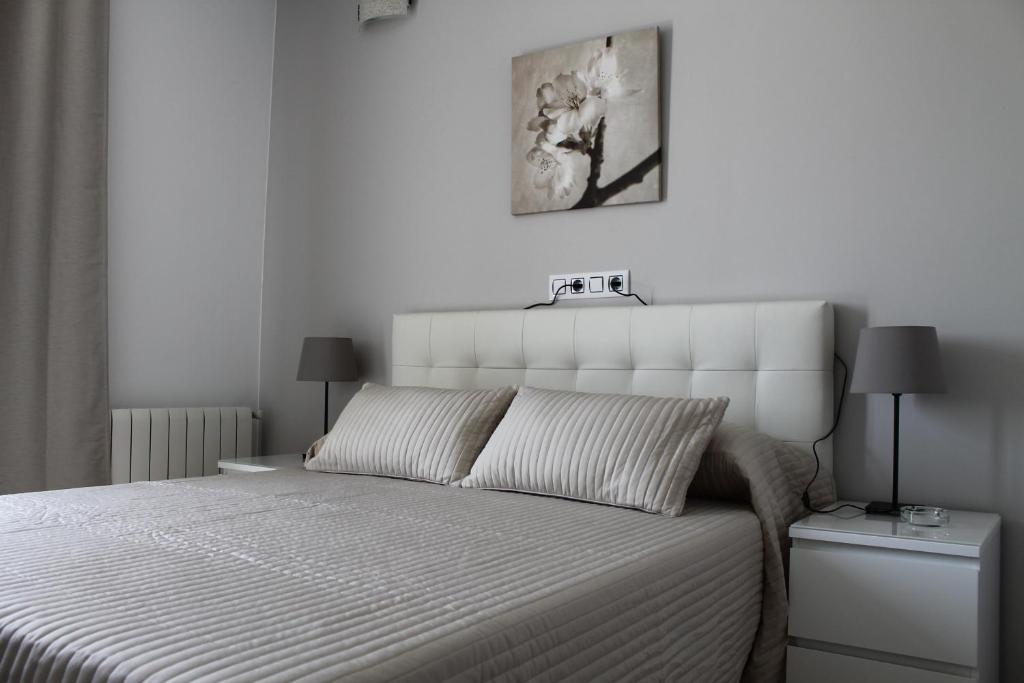 Postel nebo postele na pokoji v ubytování Hostal Landhaus