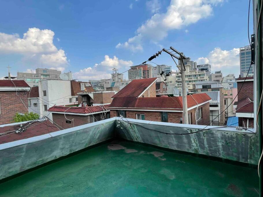 a view of the water from the roof of a building at ArinHouse in Seoul