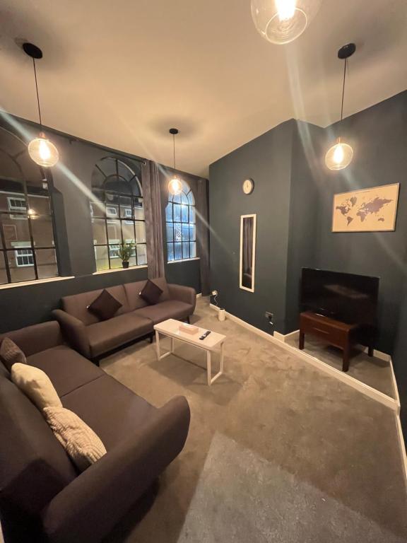 Ein Sitzbereich in der Unterkunft Modern apartment in Birmingham