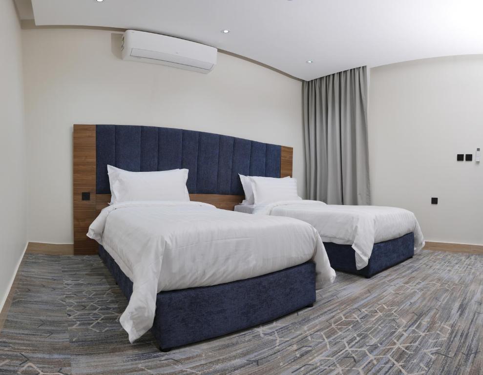 Llit o llits en una habitació de شقة فندقية Elite Corner
