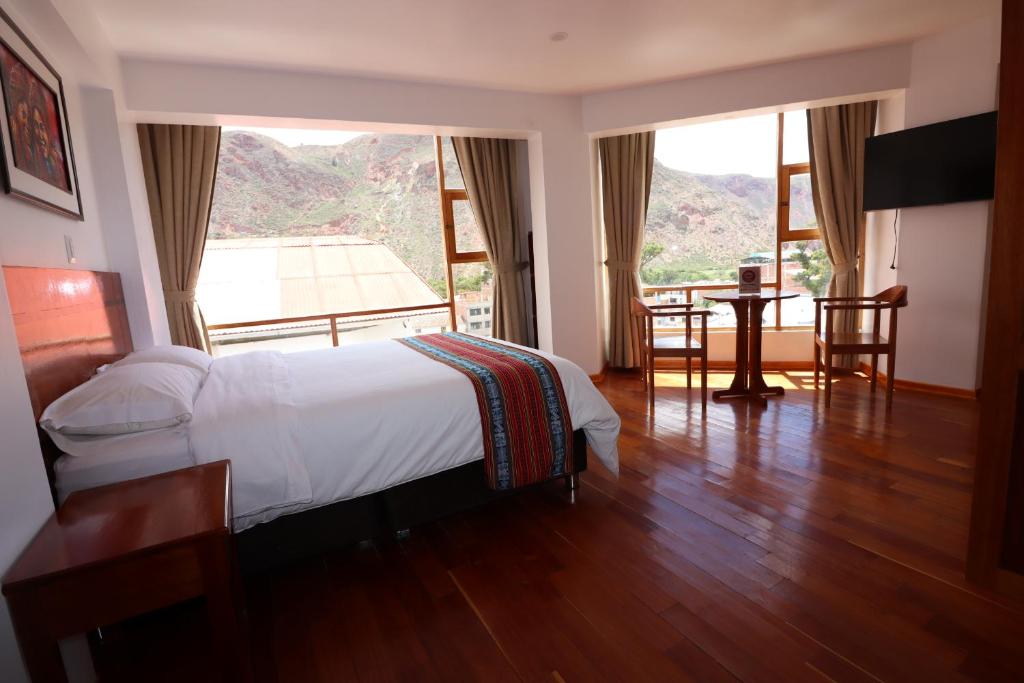 Ένα ή περισσότερα κρεβάτια σε δωμάτιο στο El SOL HOTEL - URUBAMBA