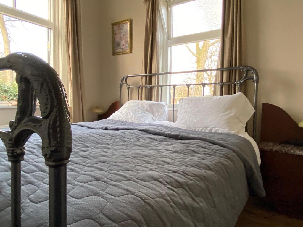 Un pat sau paturi într-o cameră la De Viersprong
