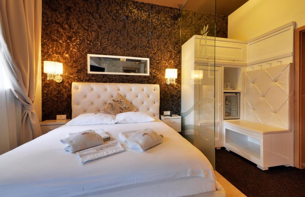 Postel nebo postele na pokoji v ubytování Hotel RICHTR