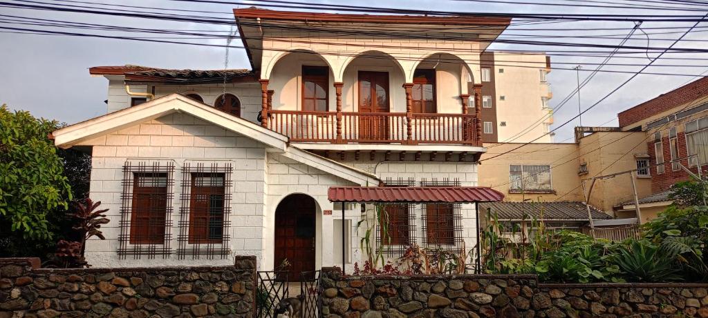 a large house with a balcony on top of it at LA MANSION in Manizales