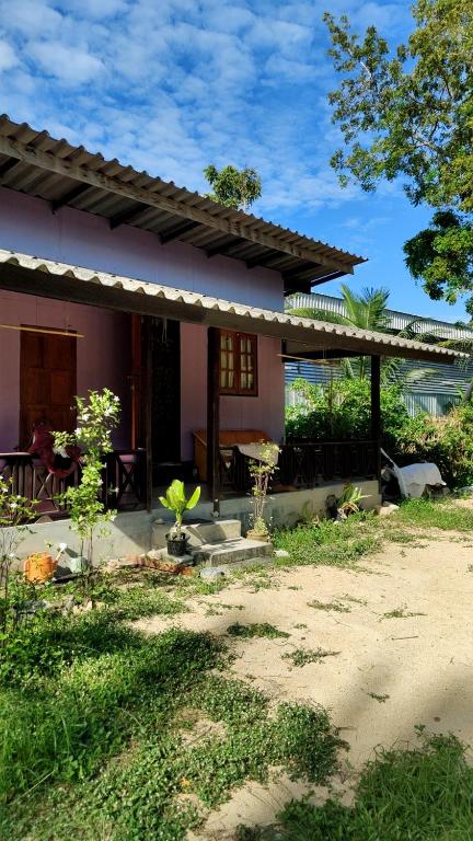 a house with a porch and a patio at Thai Style Housing in Koh Phangan