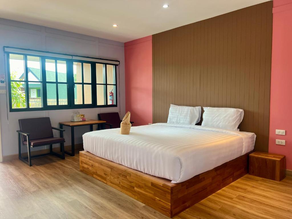 Postel nebo postele na pokoji v ubytování Napdown Resort Trat นับดาว รีสอร์ท ตราด