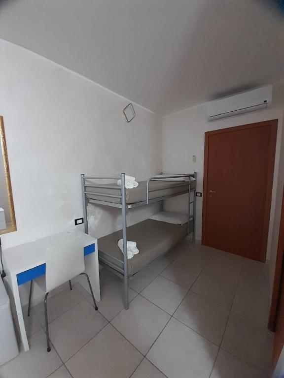 Postel nebo postele na pokoji v ubytování B&B Da Rocco