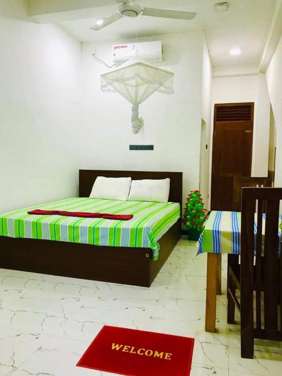 Postel nebo postele na pokoji v ubytování Green jade Inn Mirissa