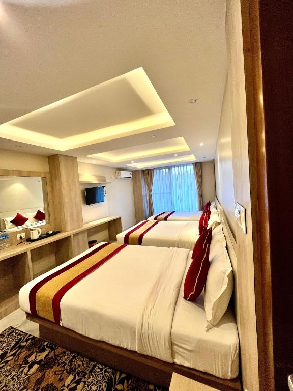 Postel nebo postele na pokoji v ubytování Hotel Prime Suite