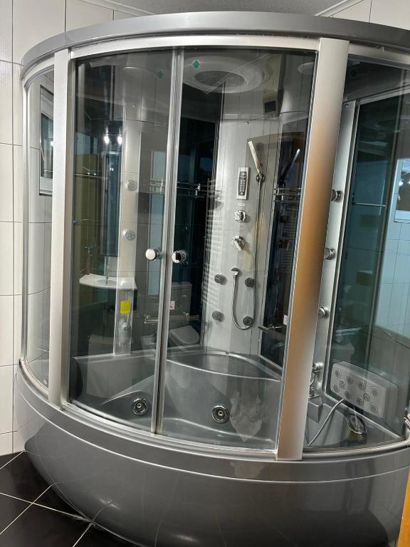 a large glass shower in a bathroom with at VILLA M Slatina Banja Luka 