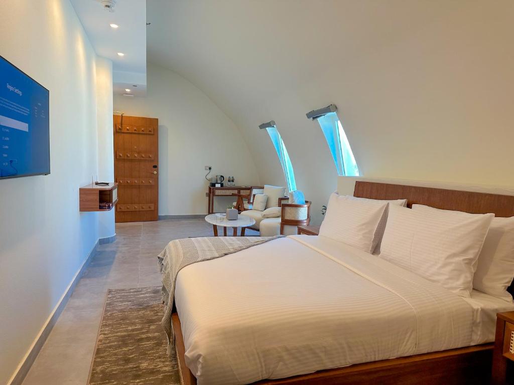Postel nebo postele na pokoji v ubytování Western Hotel Liwa