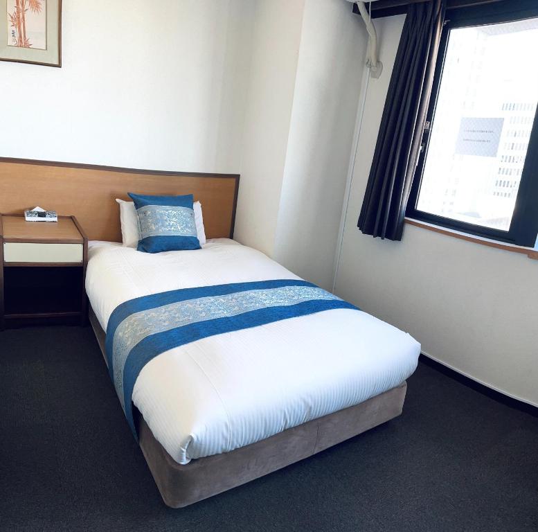 Postel nebo postele na pokoji v ubytování Ogaki Hiyori Hotel - Vacation STAY 72007v