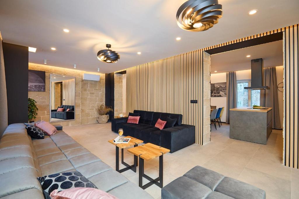 a living room with a couch and a table at Hedera Estate, Villa Hedera XVII in Dubrovnik
