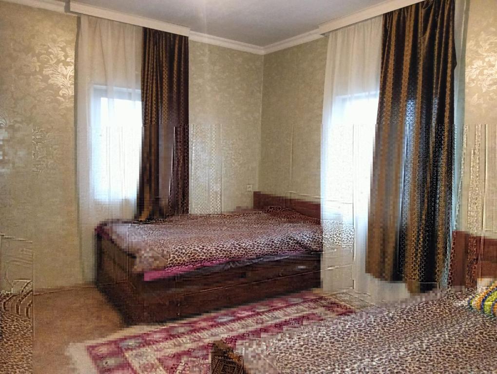Un pat sau paturi într-o cameră la Mtskheta village guest house