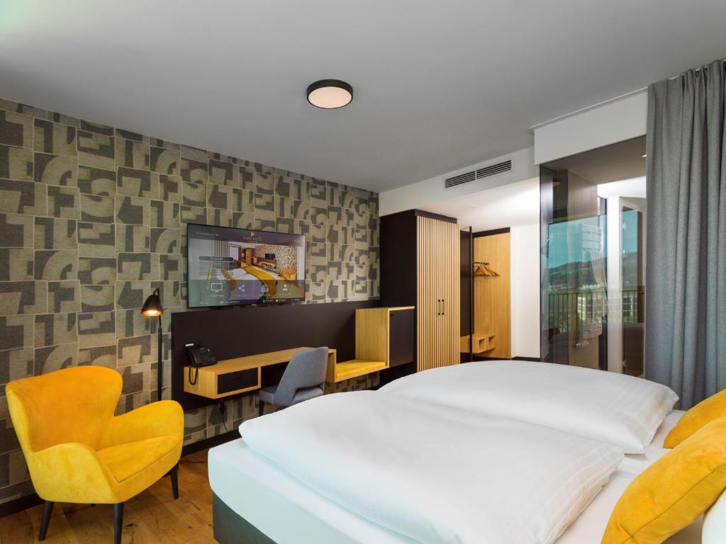 Postel nebo postele na pokoji v ubytování Best Western Parkhotel Hagenberg