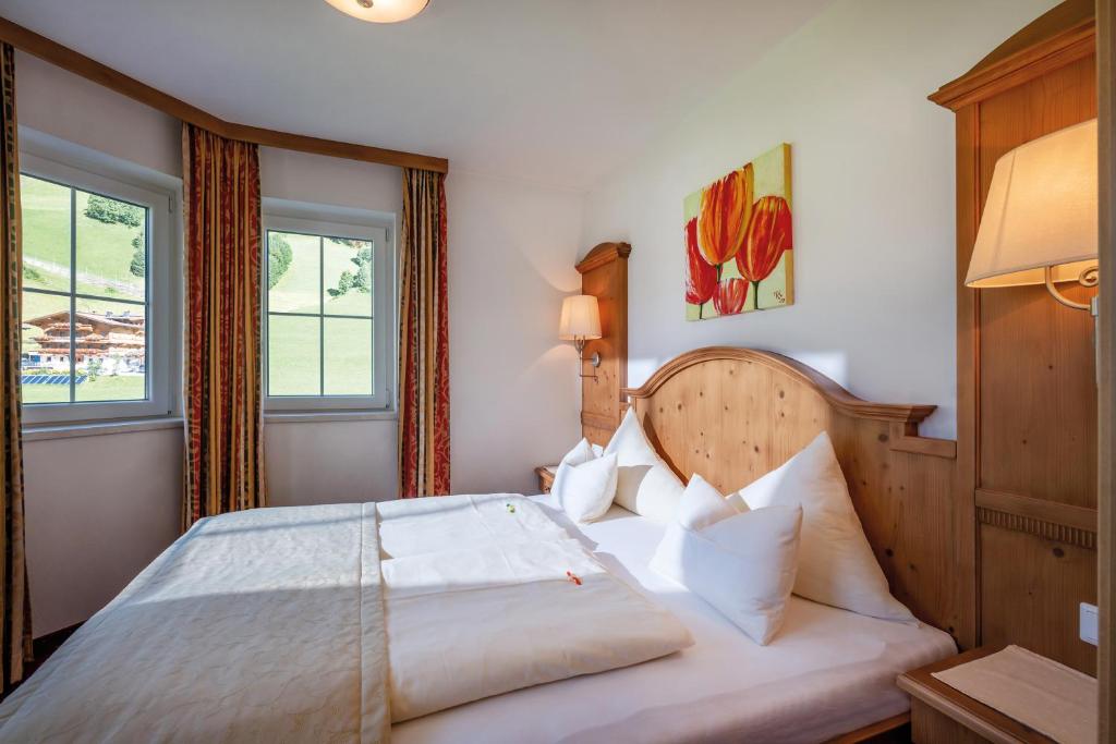 Postel nebo postele na pokoji v ubytování Hotel Maria Theresia