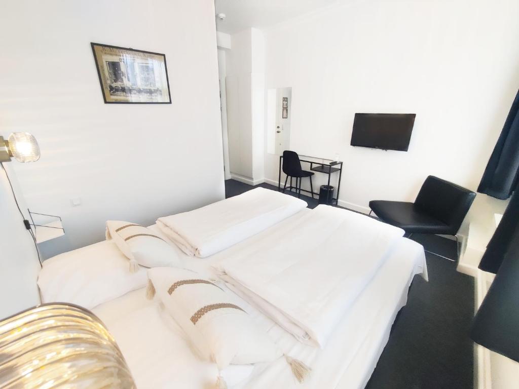 Postel nebo postele na pokoji v ubytování CentralHotellet