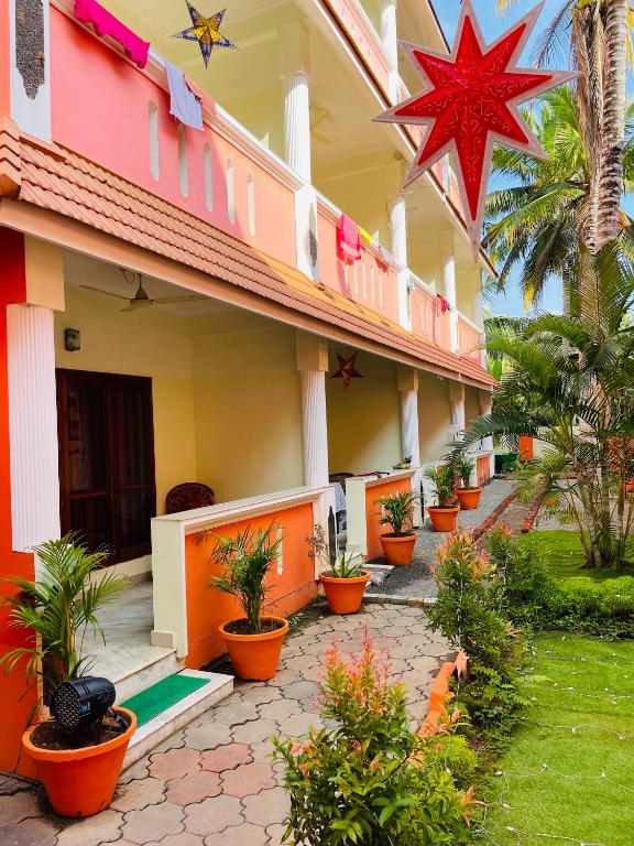 a building with a star on the side of it at Moon Valley Cottage in Kovalam
