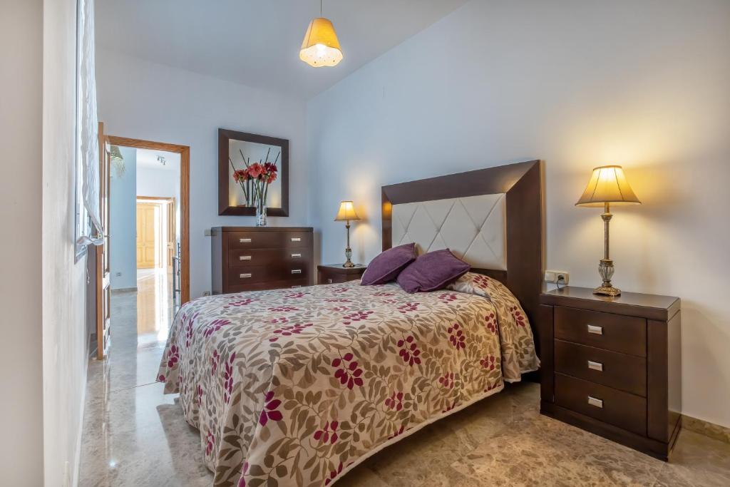 Postel nebo postele na pokoji v ubytování Kurtuba Suites