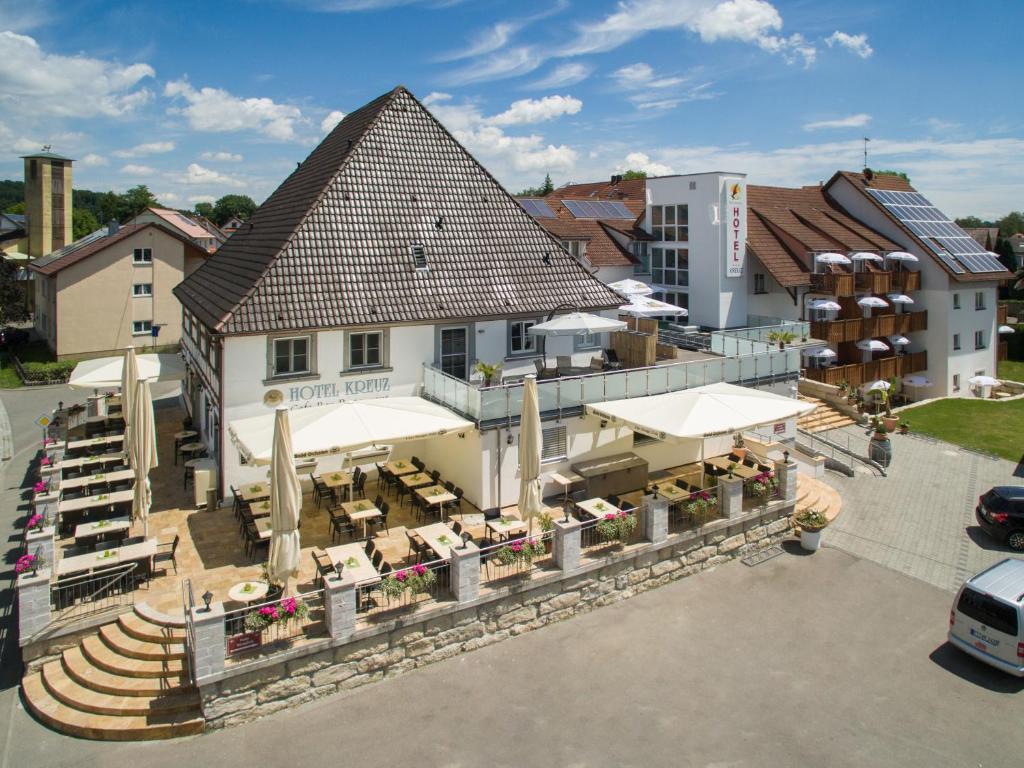 an overhead view of a building with a restaurant at Bodensee-Hotel Kreuz in Uhldingen-Mühlhofen