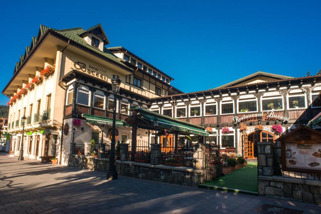 a large building with a street in front of it at Hotel Bucegi in Sinaia