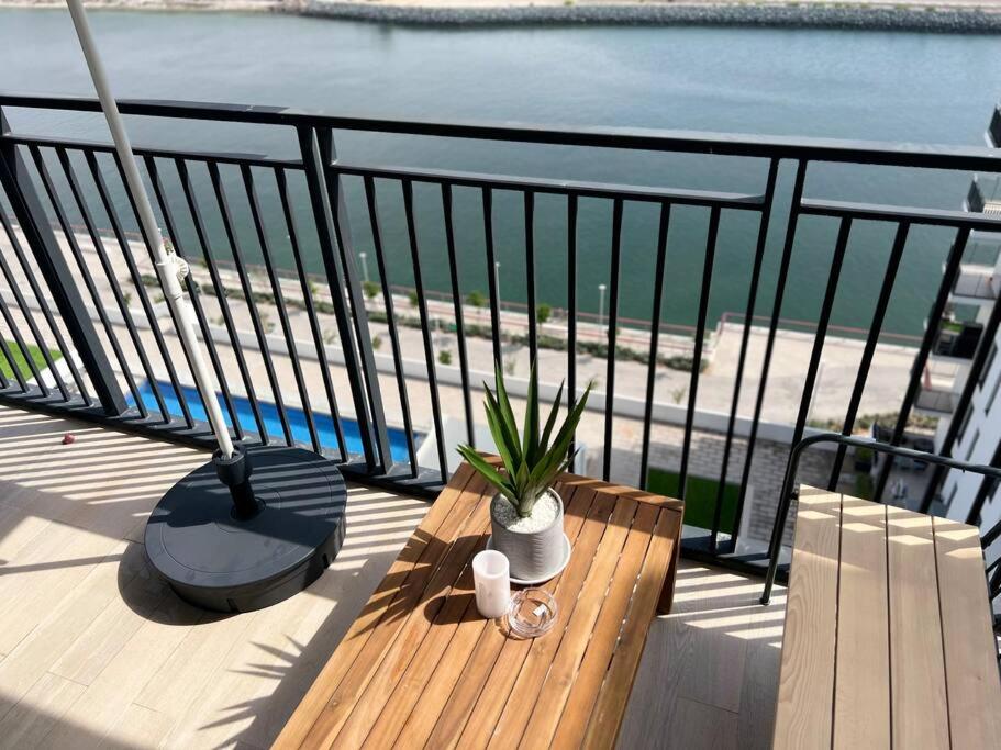 a balcony with a bench and a view of the water at Full Canal View Apartment at Yas Island- Brand New in Abu Dhabi
