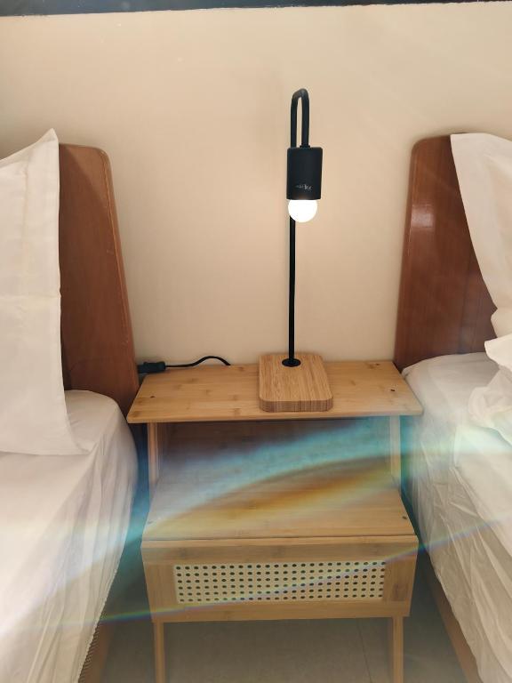 Postel nebo postele na pokoji v ubytování 小憩人輕旅