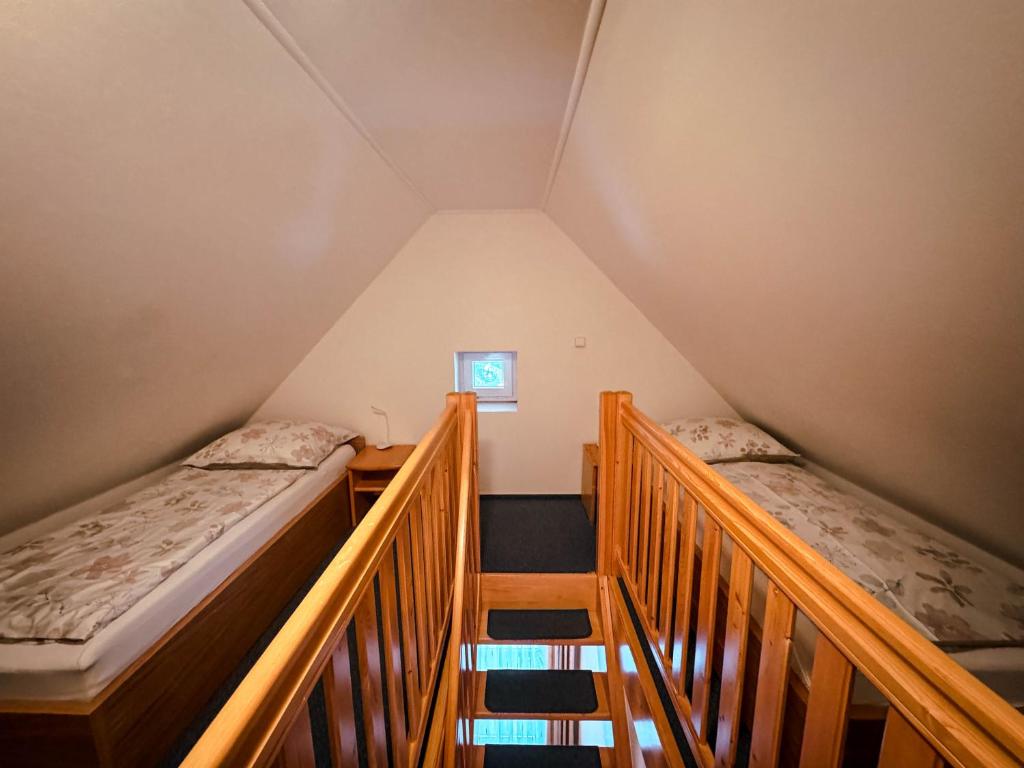 Postel nebo postele na pokoji v ubytování Apartmany Kolb Ramzová