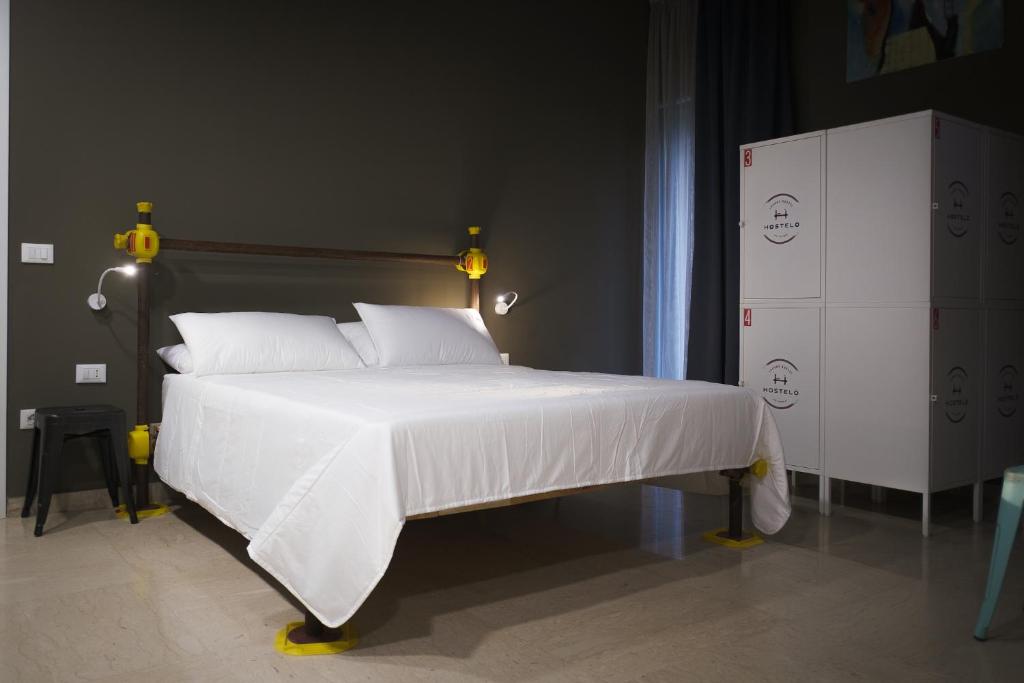 Postel nebo postele na pokoji v ubytování Hostelò - Luxury Hostel