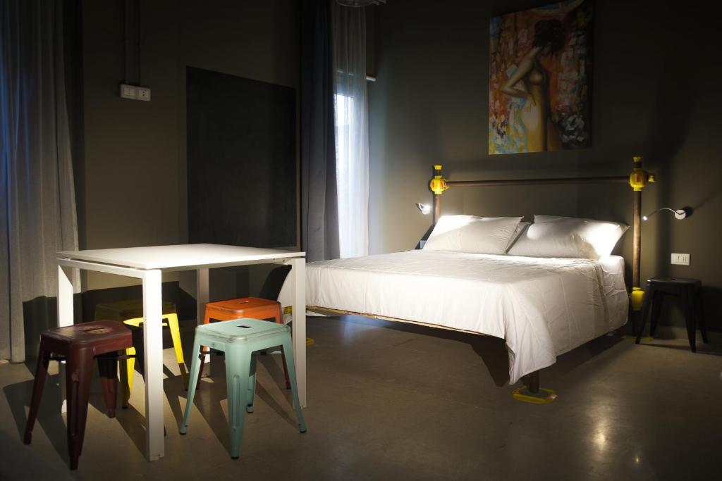 Postel nebo postele na pokoji v ubytování Hostelò - Luxury Hostel