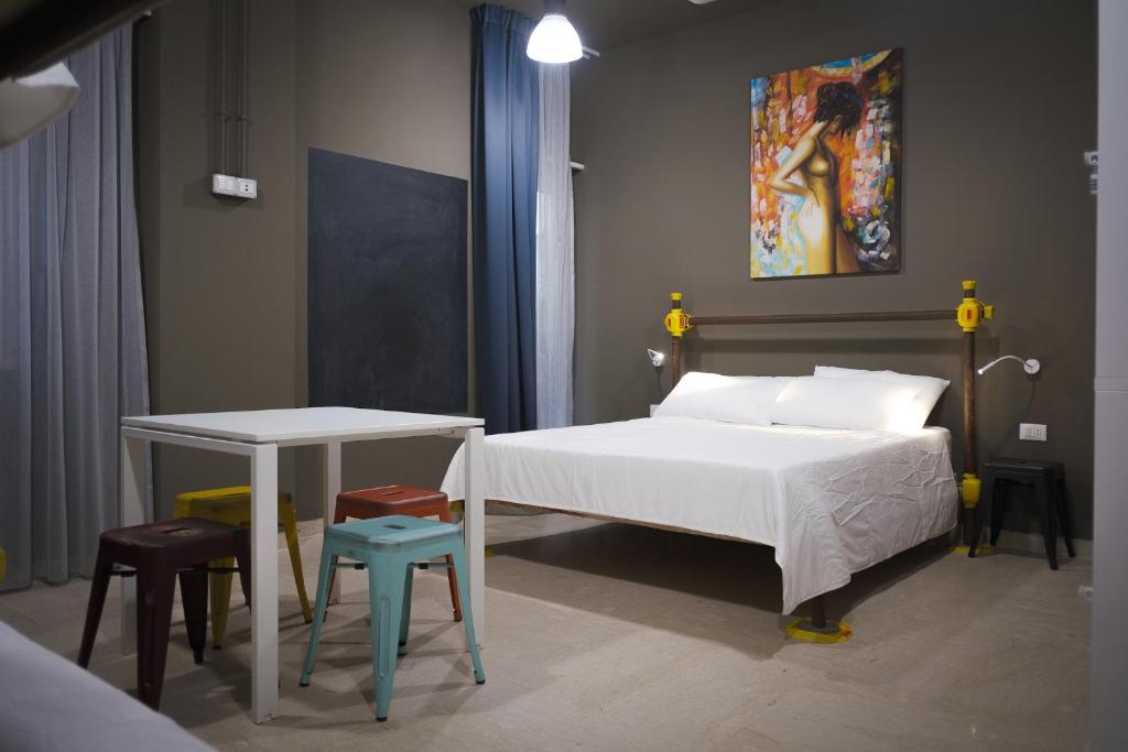 Postel nebo postele na pokoji v ubytování Hostelò - Luxury Hostel