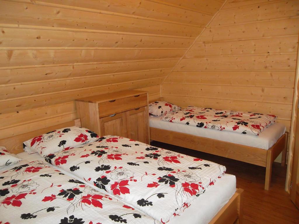 Postel nebo postele na pokoji v ubytování Chata Sipkova II