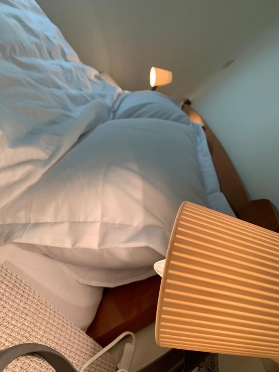 Postel nebo postele na pokoji v ubytování 小憩人輕旅