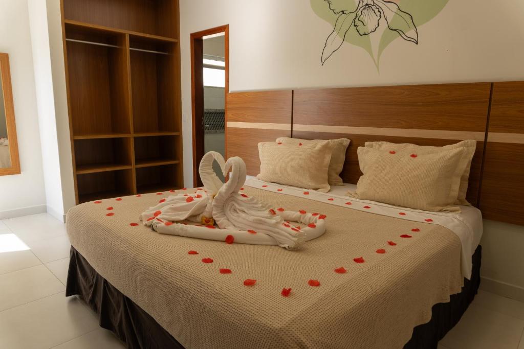 Postel nebo postele na pokoji v ubytování Orquídeas Praia Hotel